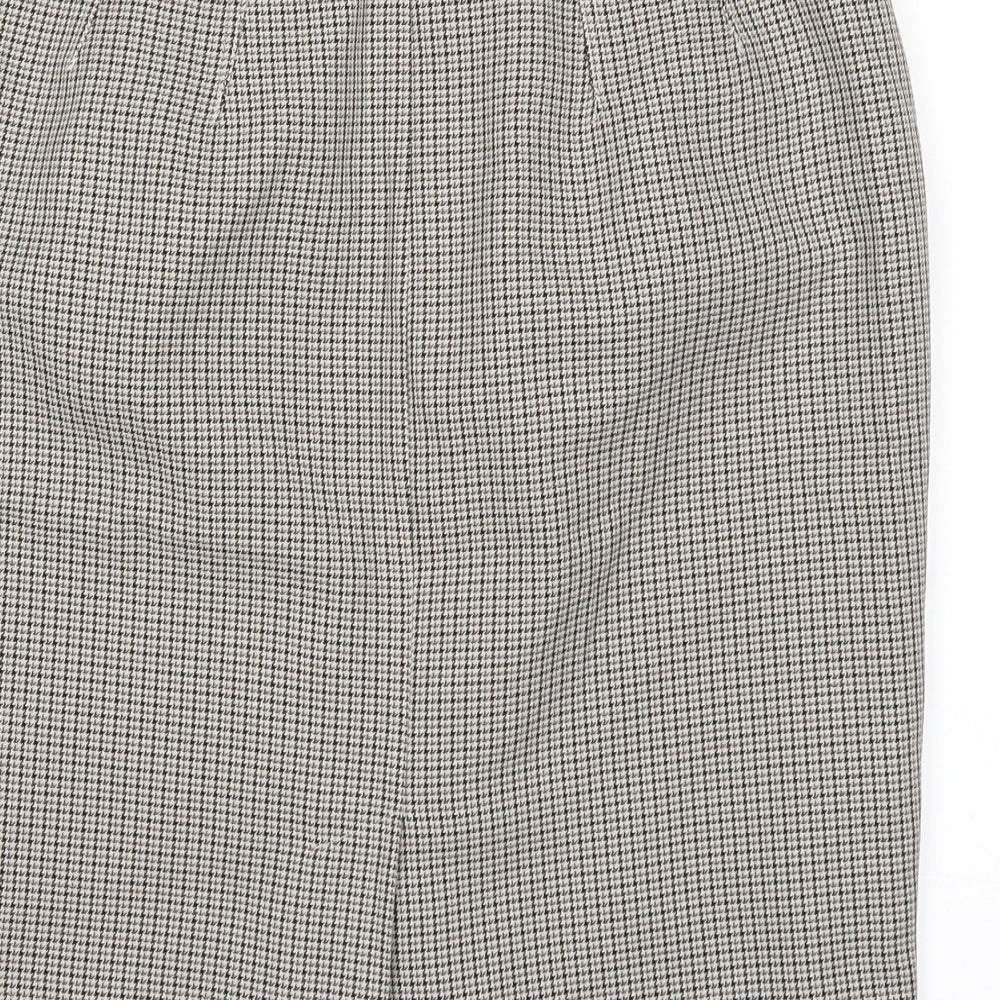 Brand and care label for Marks & Spencer women’s brown a-line skirt, size UK 10