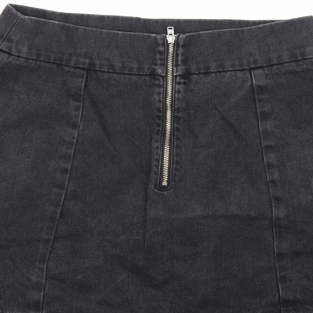 Brand and care label for Preworn women’s black denim mini skirt, size UK 26, in