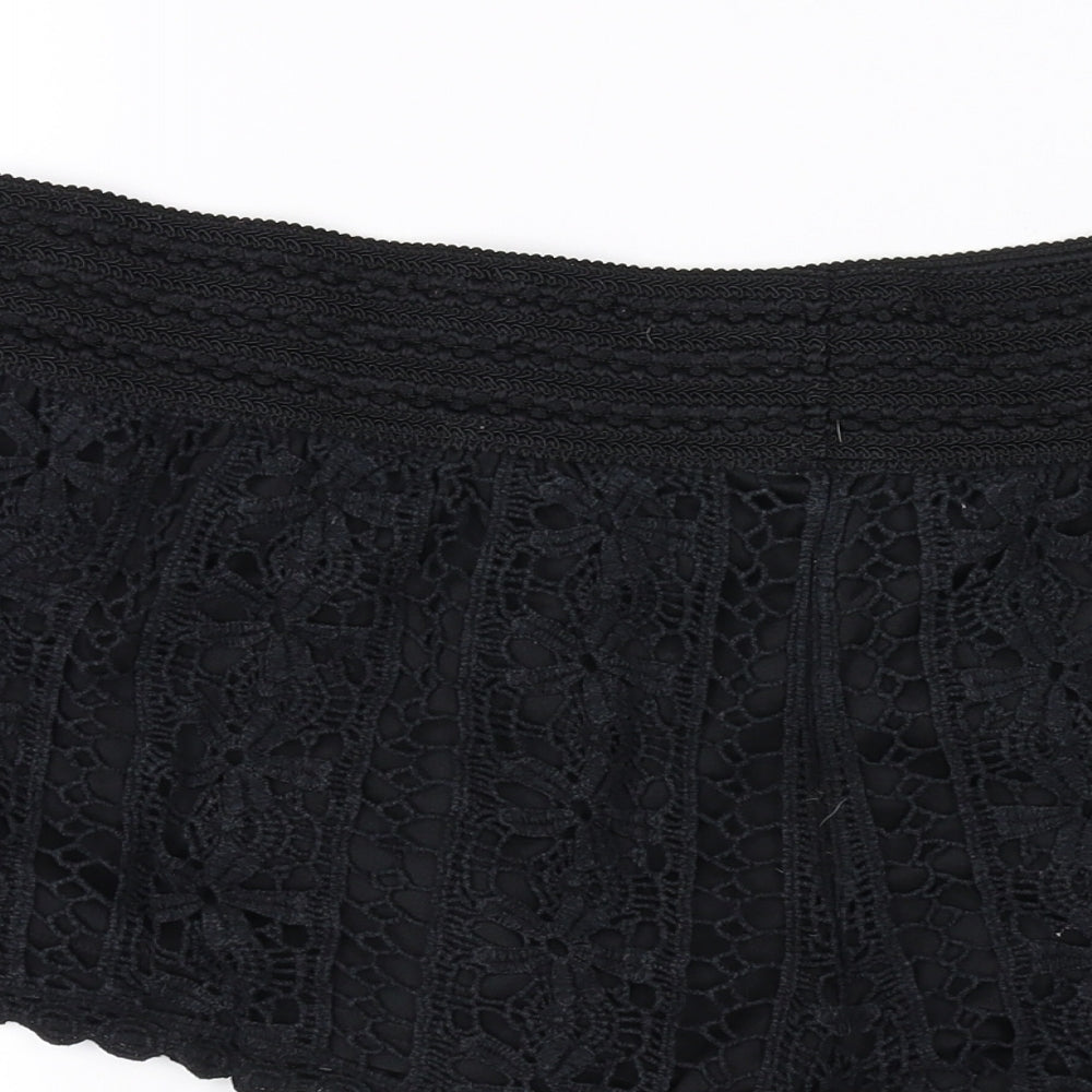 Brand and care label for Rewind women’s black sweat shorts, size L