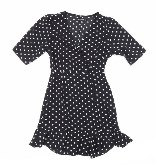 Additional front view of PRETTYLITTLETHING women’s black polka dot a-line, size UK 2