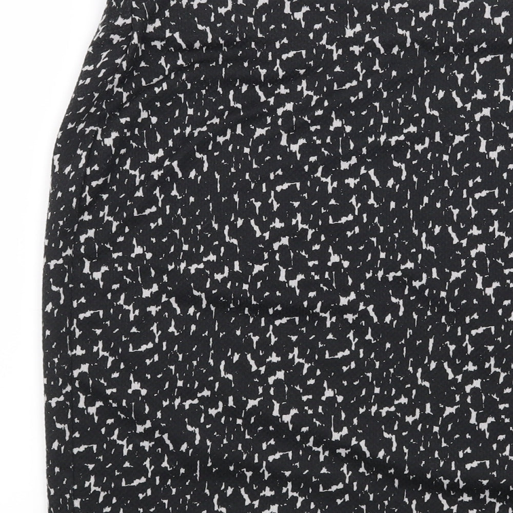Brand and care label for Marks & Spencer women’s black geometric straight & pencil skirt, size UK 32, in