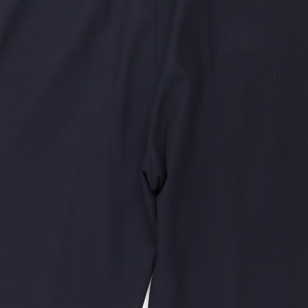 Brand and care label for St Bernard women’s blue trousers, size UK 42, in, 27-inch leg