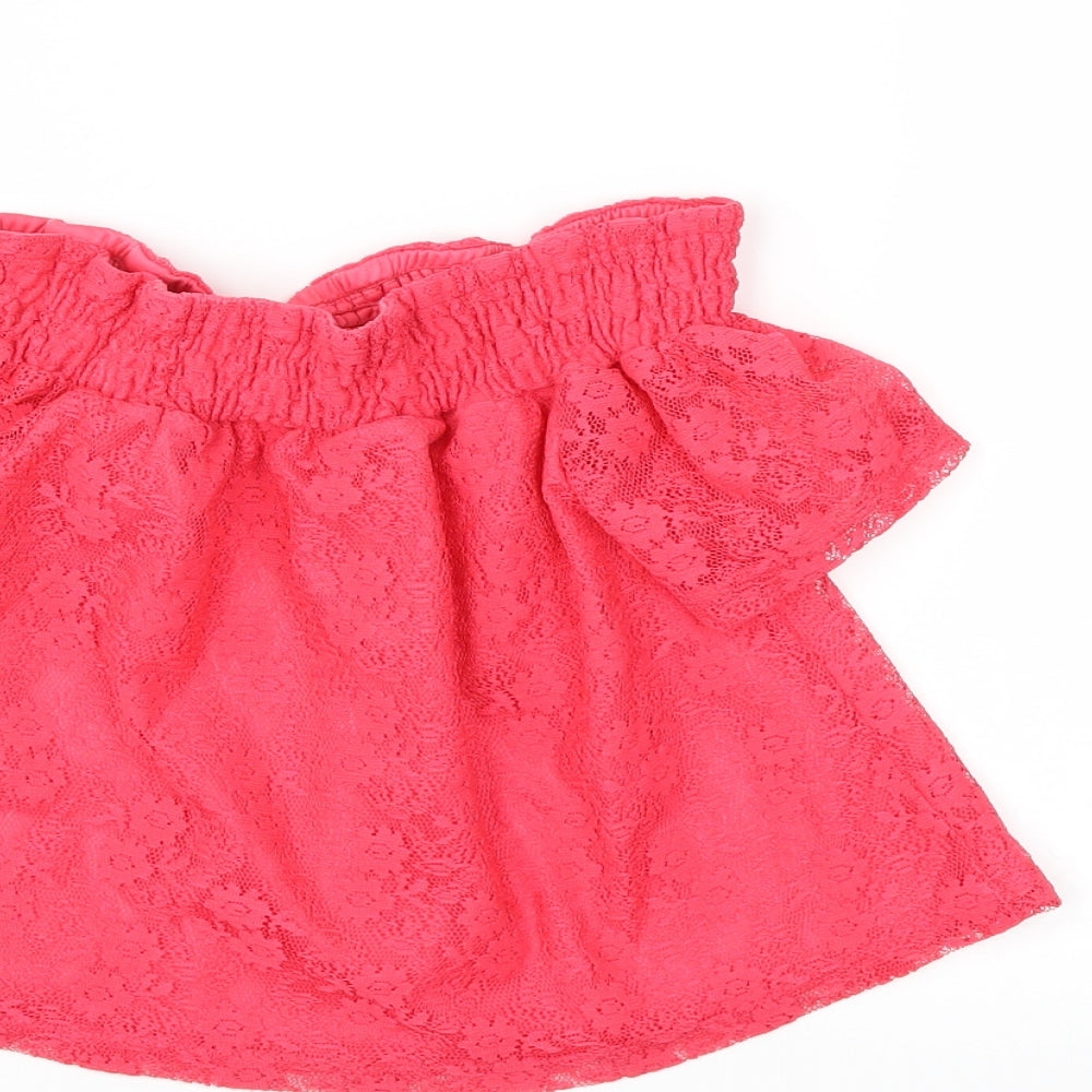 Brand and care label for Primark girls’ red basic blouse, size 8, years