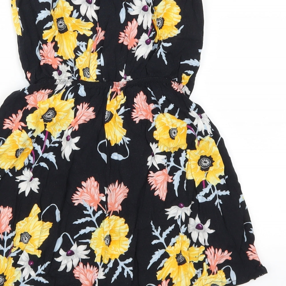 Brand and care label for H&M women’s multicoloured flecked playsuit one-piece, size UK 6