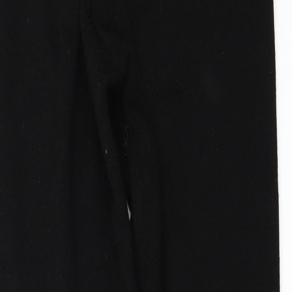 Brand and care label for Missguided women’s black trousers, size M, 30-inch leg