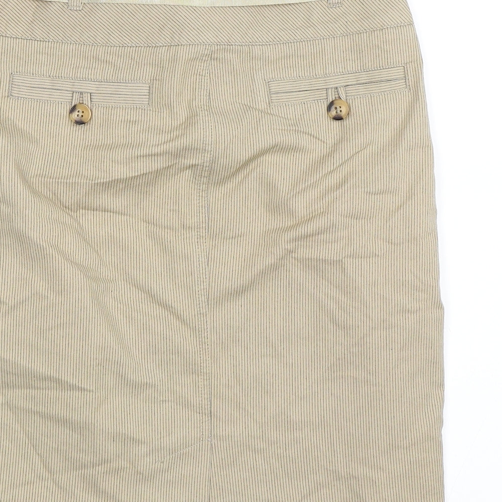 Brand and care label for Marks & Spencer women’s beige a-line skirt, size UK 8