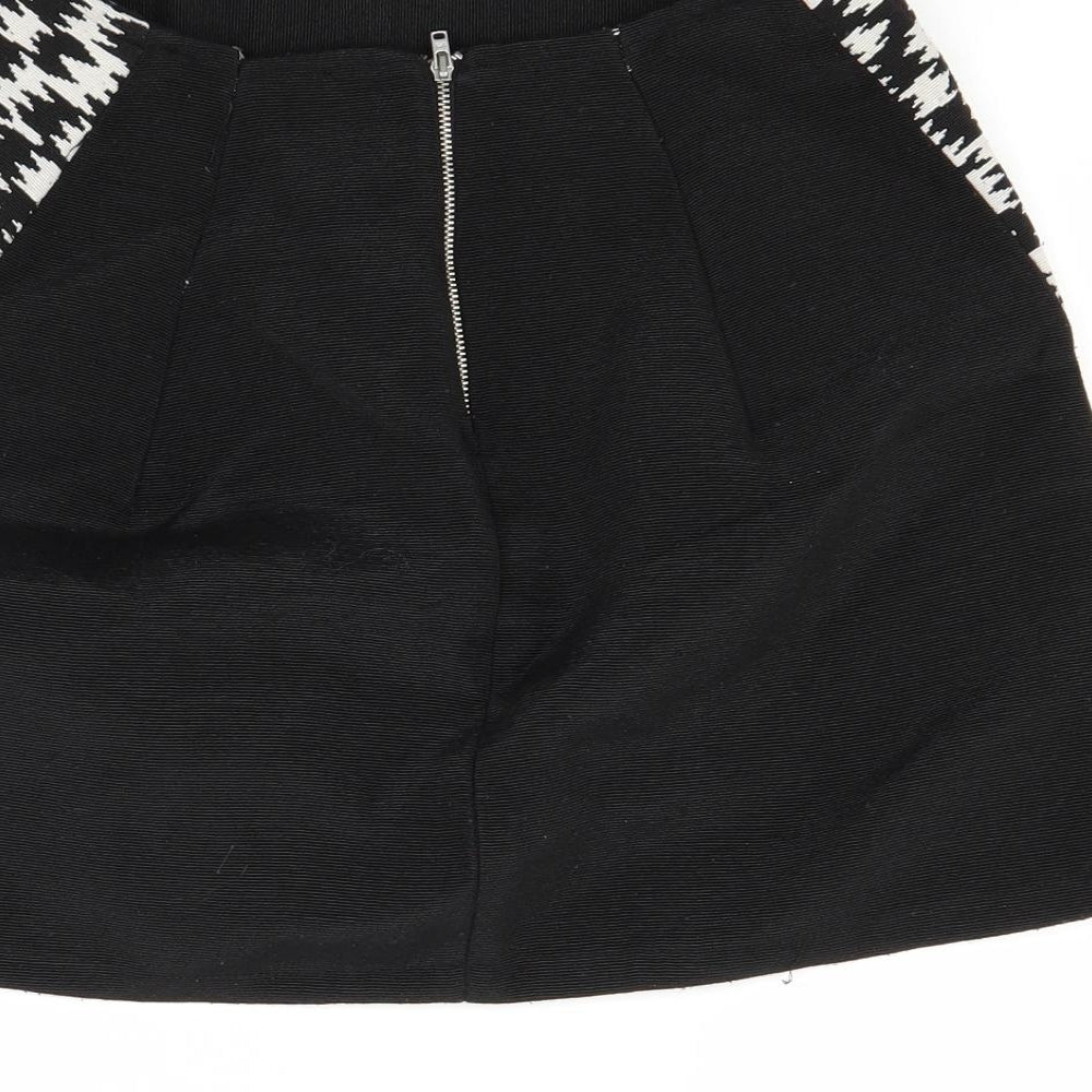 Brand and care label for Primark women’s white mini skirt, size UK 10