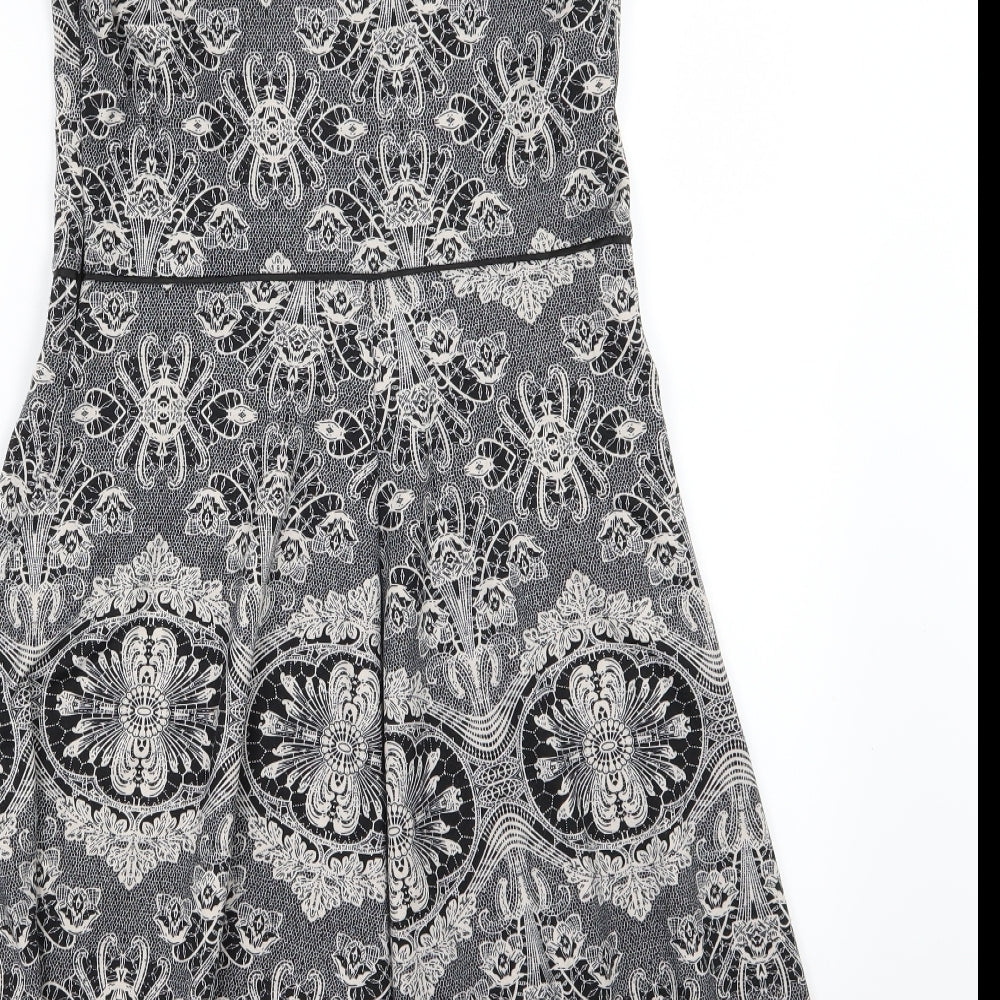 Brand and care label for Dorothy Perkins women’s grey floral skater dress, size UK 8