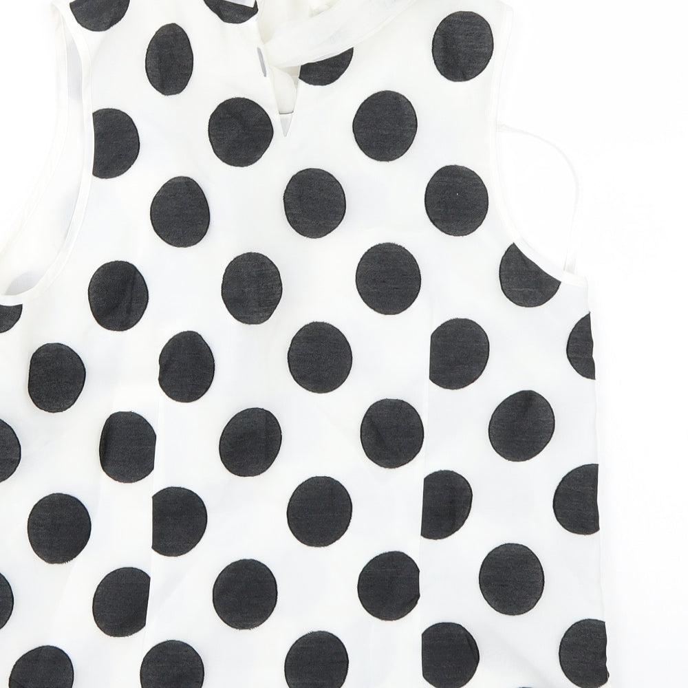 Brand and care label for Coast women’s white polka dot basic blouse, size UK 10