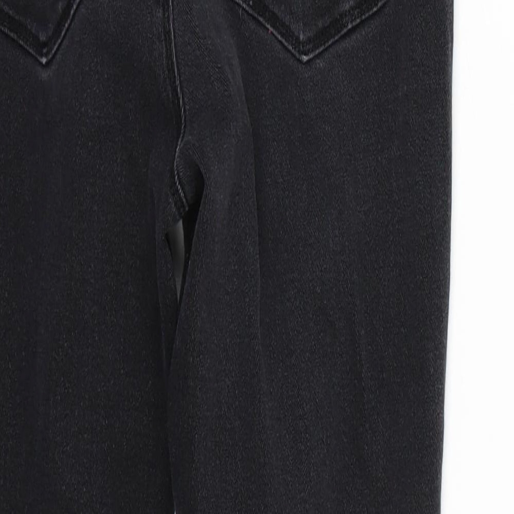 Brand and care label for Boohoo women’s black skinny jeans, size UK 12, 26-inch leg