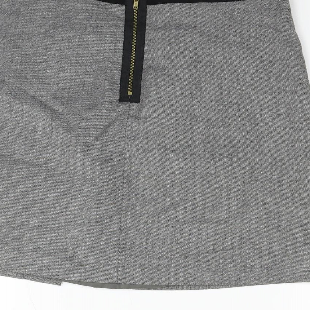 Brand and care label for H&M women’s grey flare skirt, size UK 12