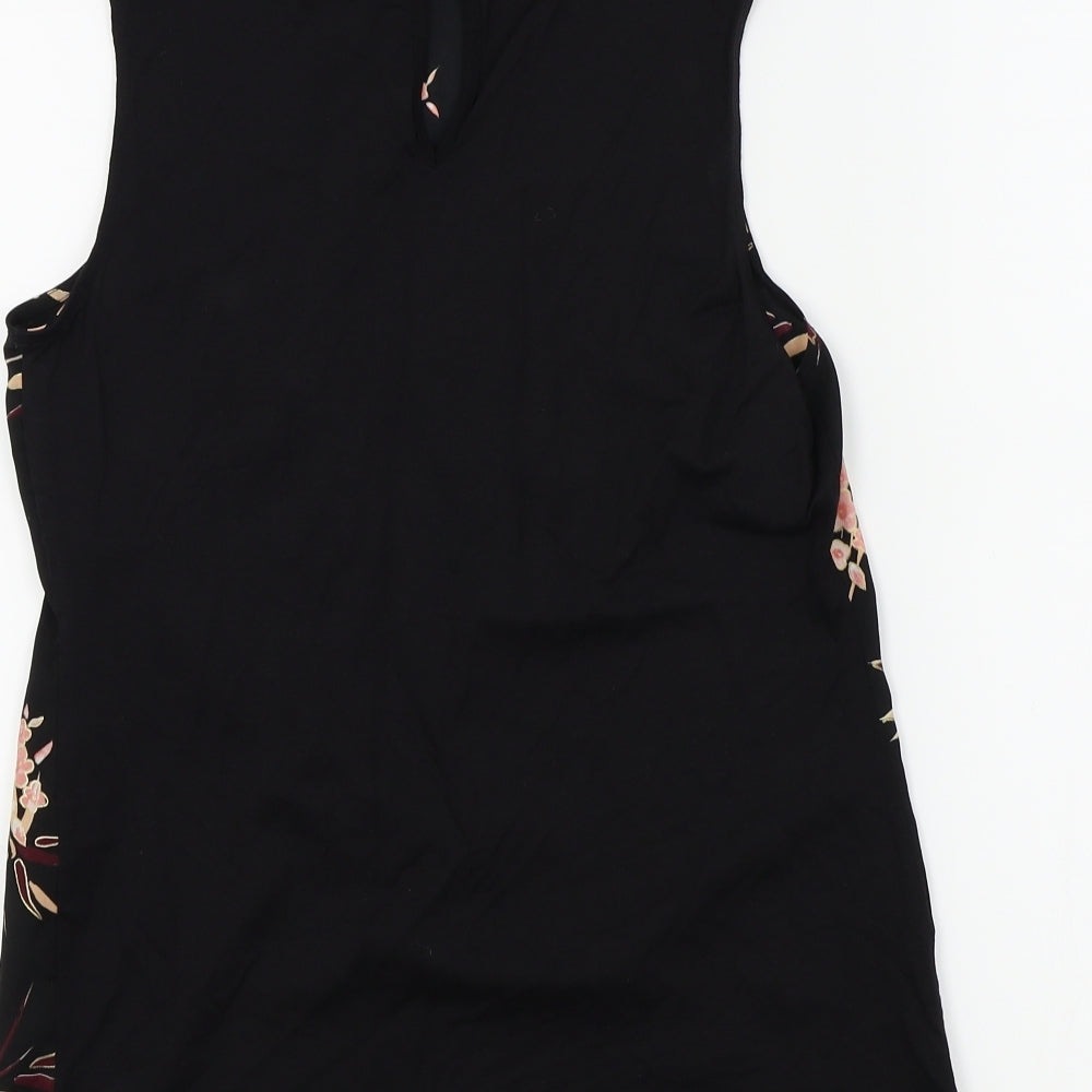 Brand and care label for F&F women’s black floral basic blouse, size UK 6