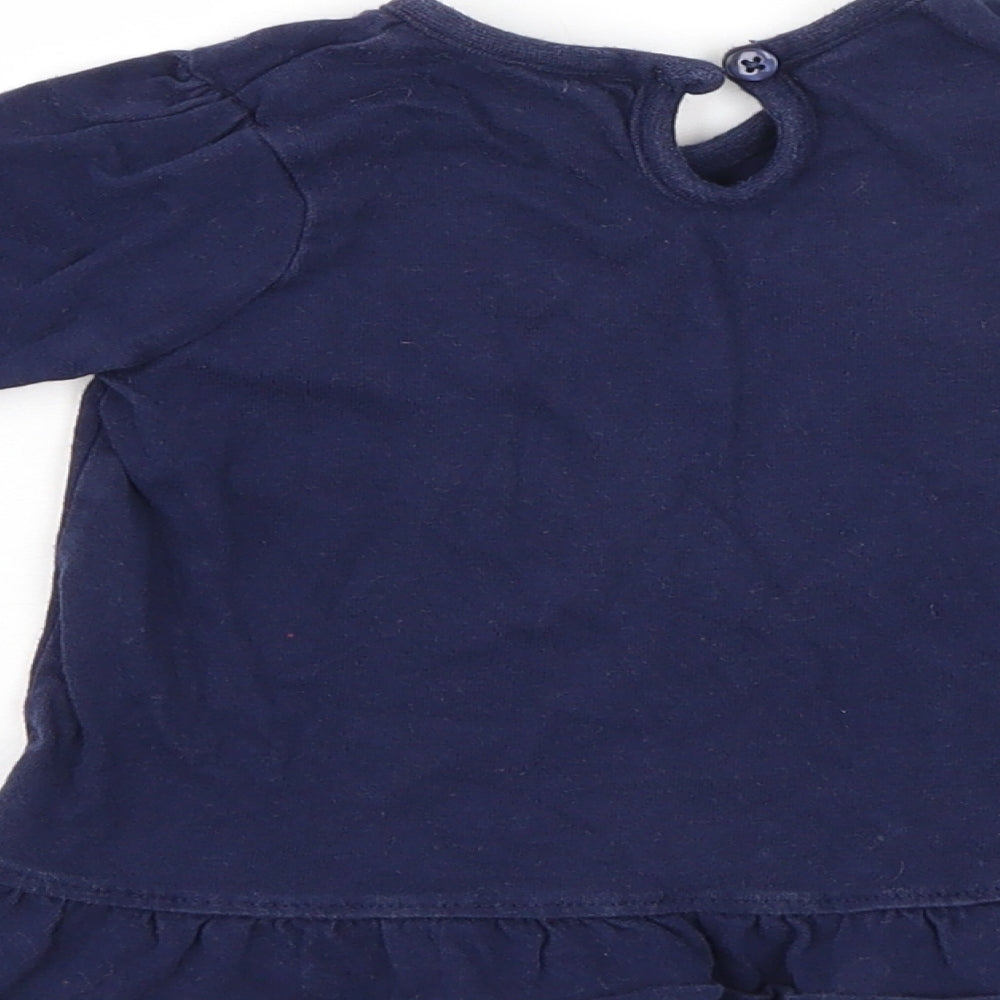 Brand and care label for George girls’ blue jumper, size 6-9, months