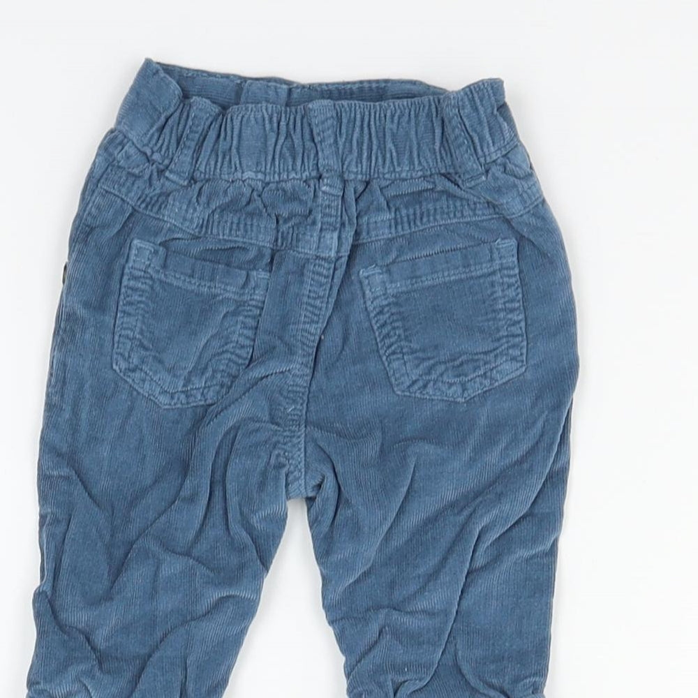Brand and care label for Holly Willoughby boys’ blue cargo trousers, size 0-3, months