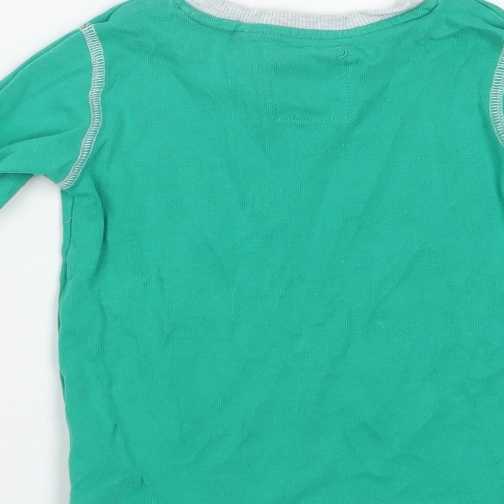 Brand and care label for Next boys’ green geometric pyjama top, size 2-3, years