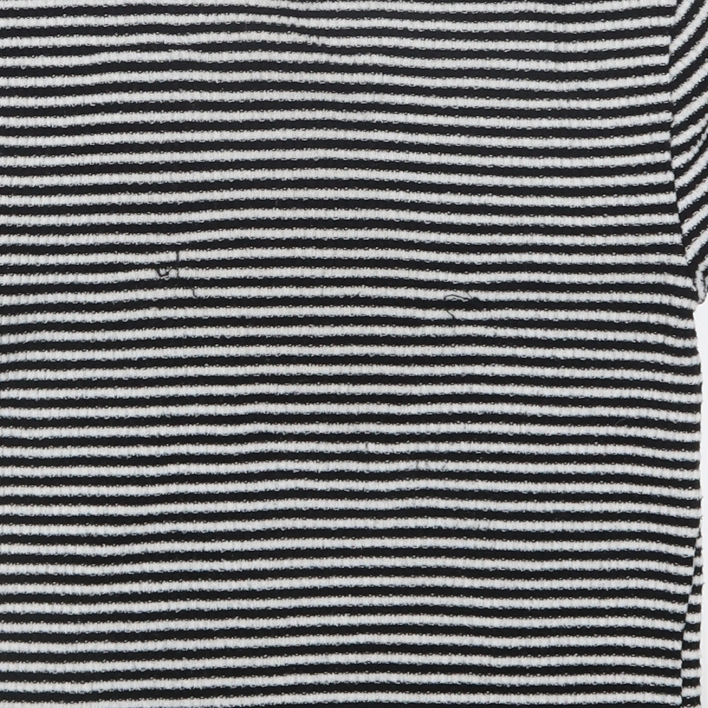 Brand and care label for Forever 21 women’s black striped knit basic t-shirt, size M