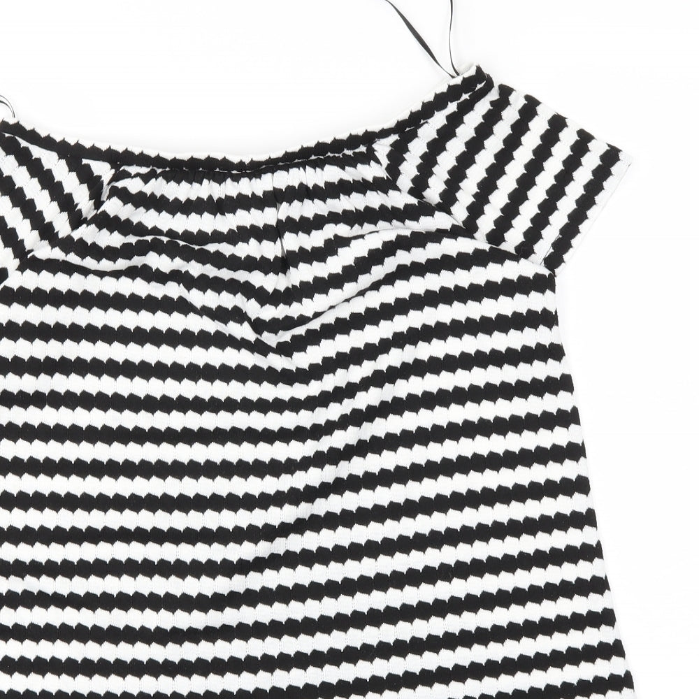 Brand and care label for F&F women’s black striped basic blouse, size UK 8