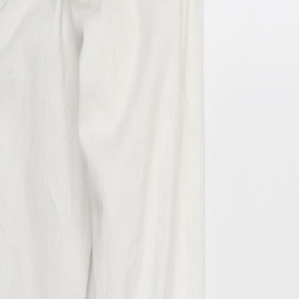 Brand and care label for Never Denim women’s white denim capri jeans, size XS, 26-inch leg