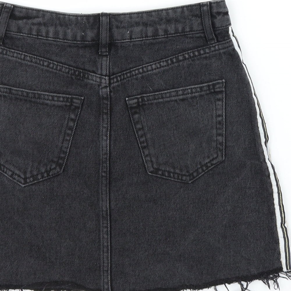 Brand and care label for Primark women’s black denim a-line skirt, size UK 4