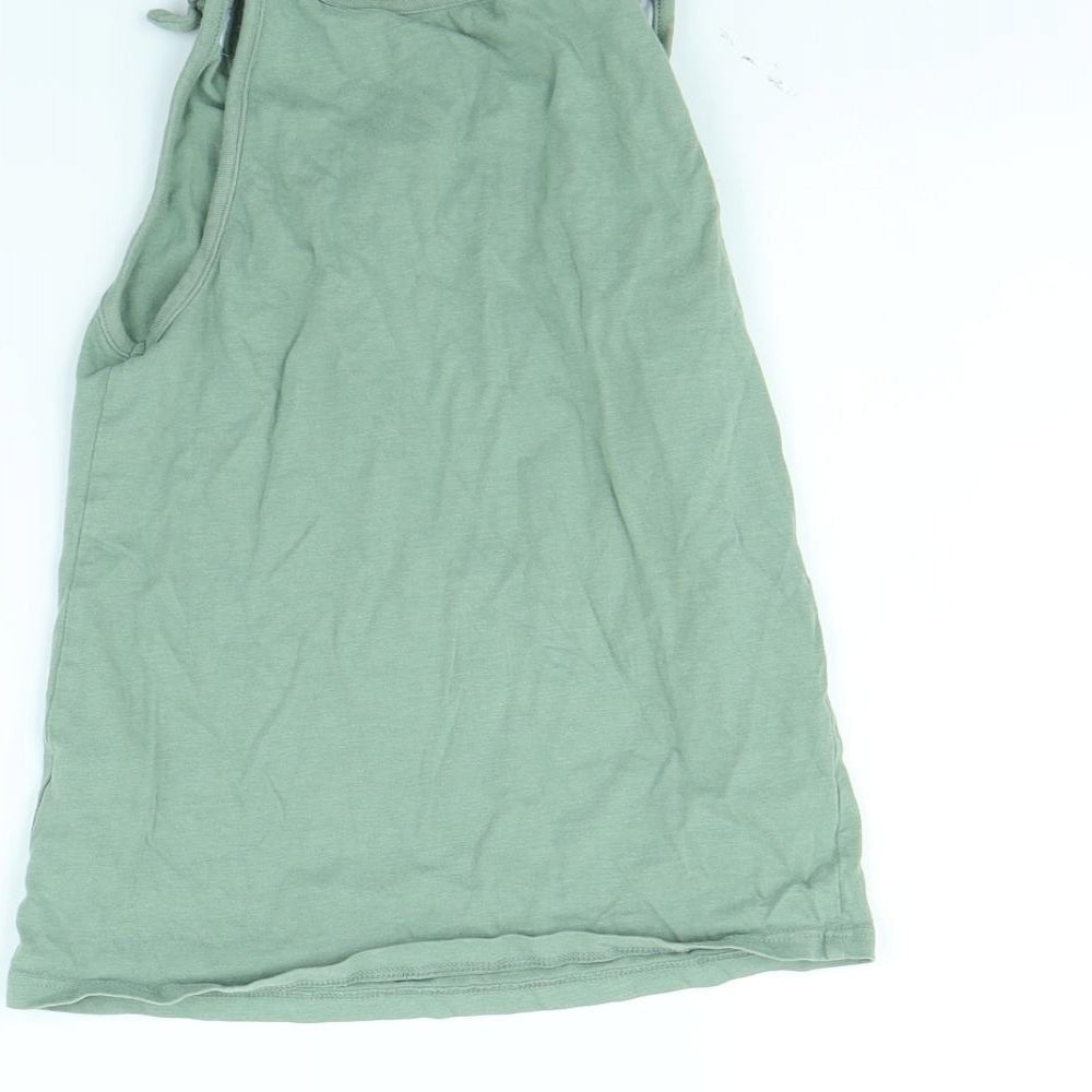 Brand and care label for George girls’ green basic tank, size 8, years