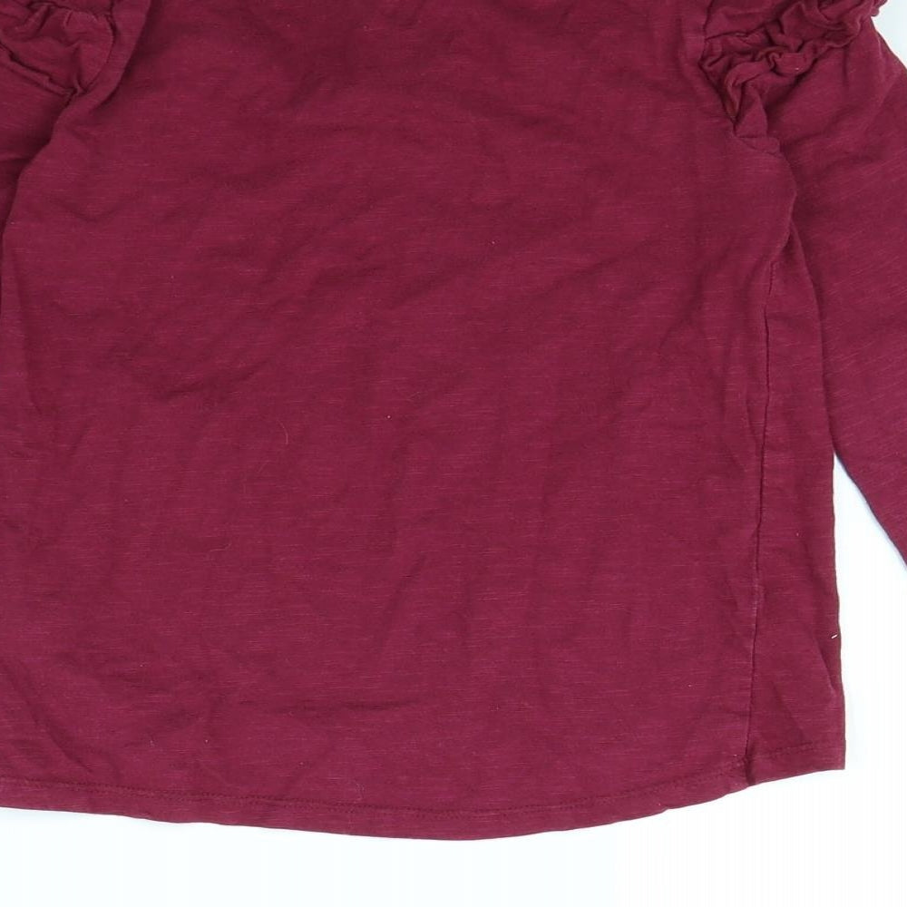 Brand and care label for Nutmeg girls’ purple basic t-shirt, size 8, years