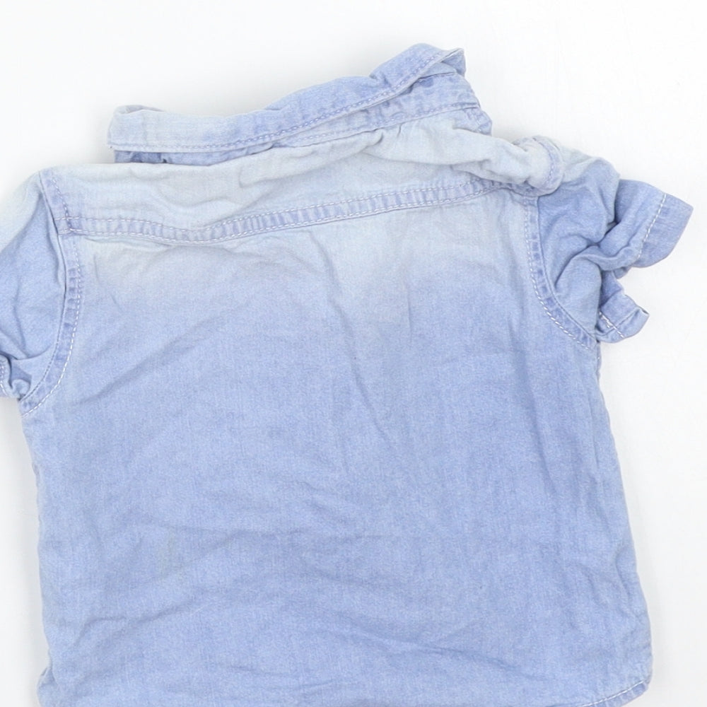 Brand and care label for Primark girls’ blue basic button-up, size 6-9, months