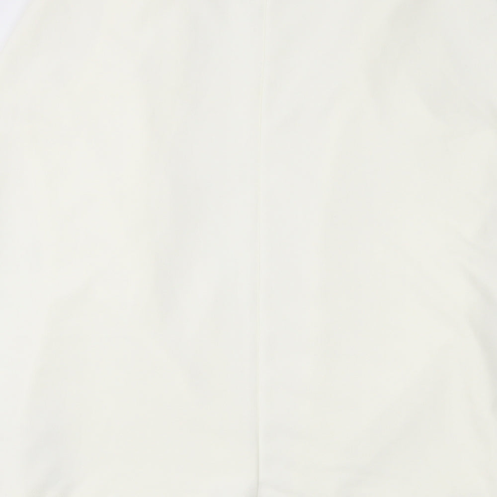 Brand and care label for Missguided women’s ivory waistcoat, size UK 6