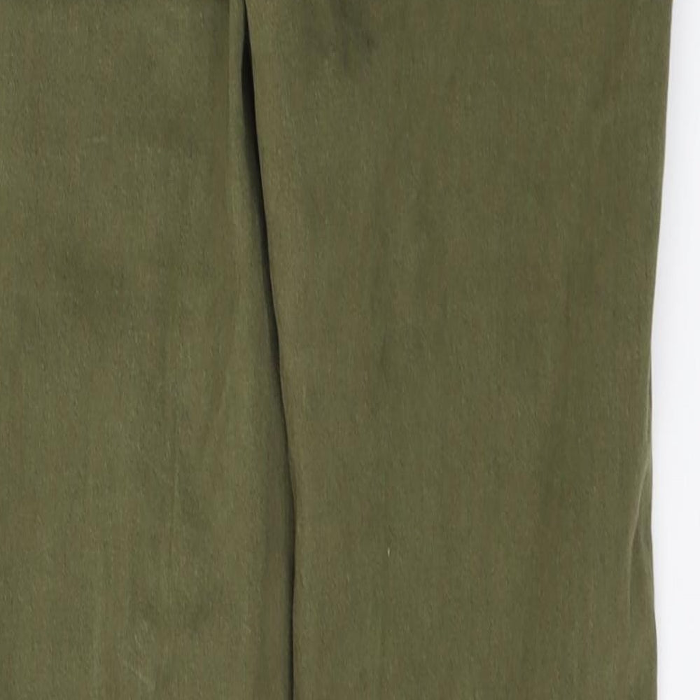 Brand and care label for Miss Selfridge women’s green denim jegging jeans, size UK 10, 28-inch leg