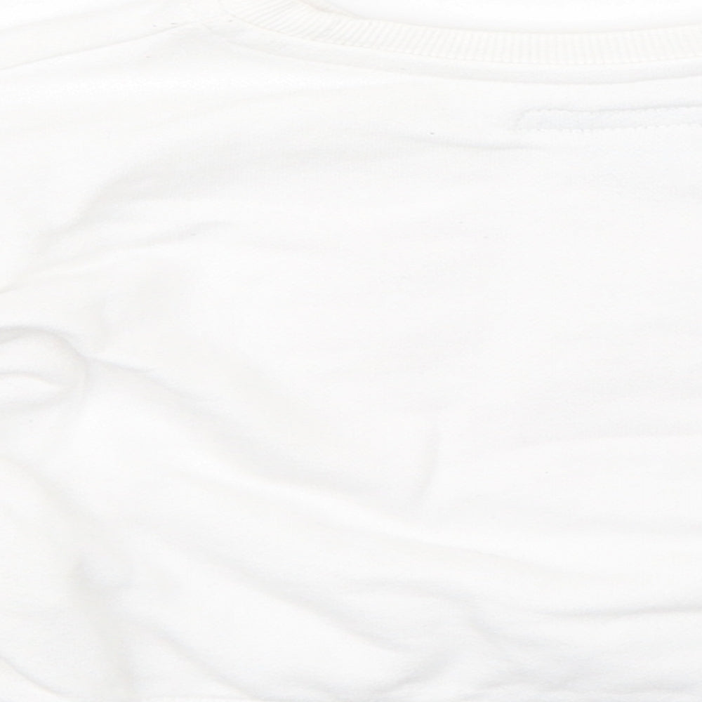 Brand and care label for Primark girls’ white jumper, size 12-18, months