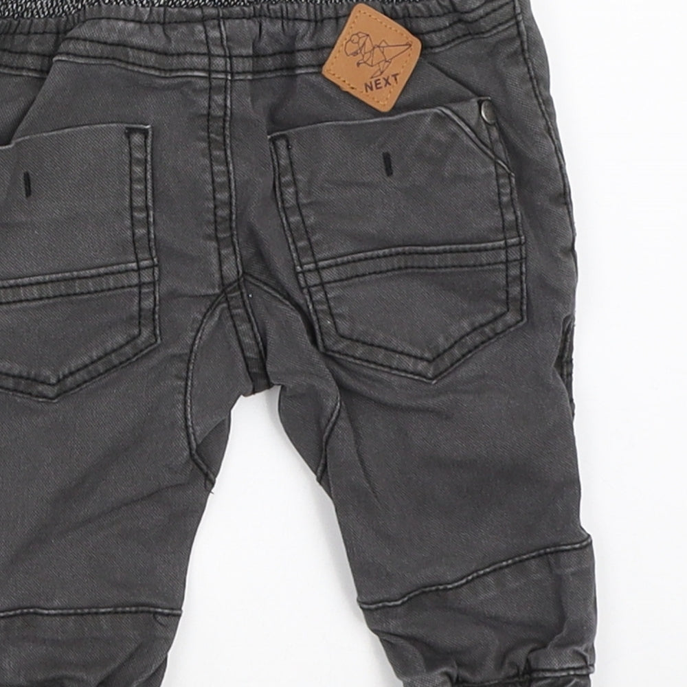 Brand and care label for Next boys’ grey jogger jeans, size 3-6, months