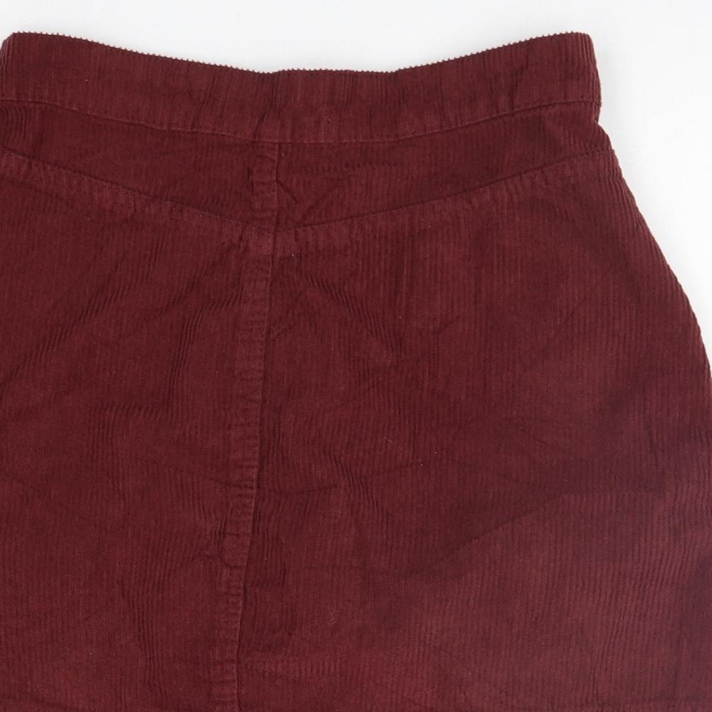 Brand and care label for Denim & Co. women’s pink a-line skirt, size UK 6