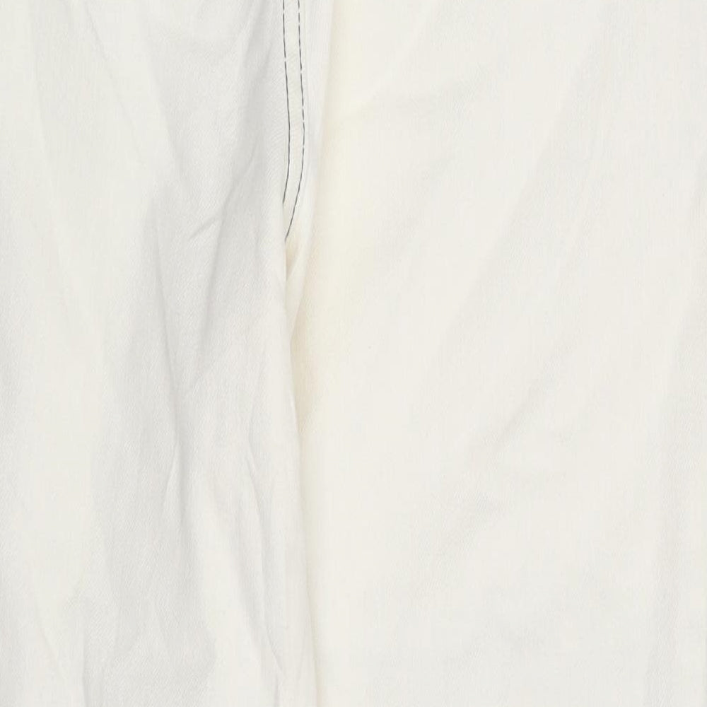 Brand and care label for ASOS women’s ivory denim tapered jeans, size UK 26, in, 25-inch leg