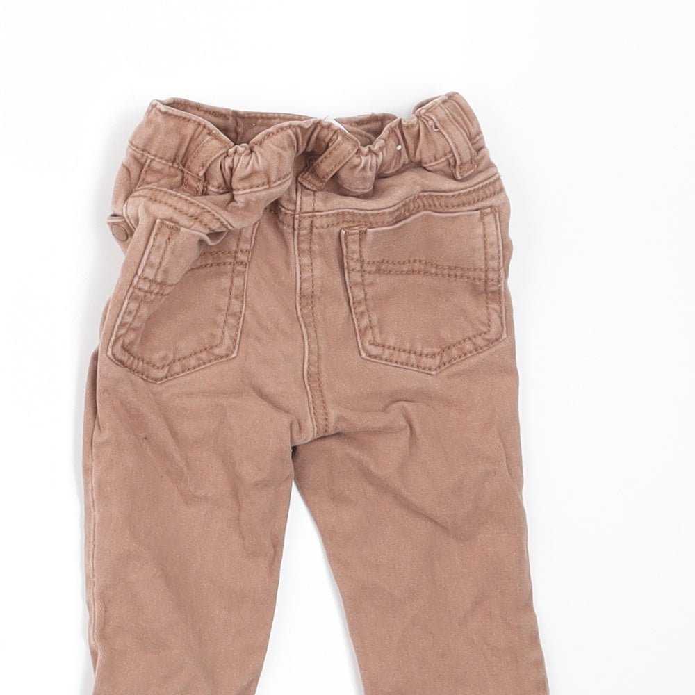 Brand and care label for Next boys’ beige denim jogger jeans, size 6-9, months