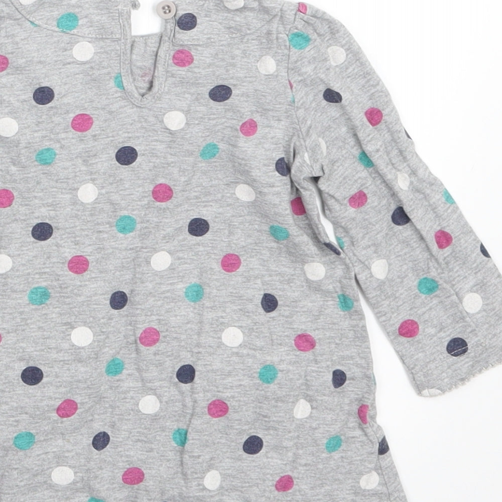 Brand and care label for Mini Club girls’ grey polka dot basic t-shirt, size 6-9, months