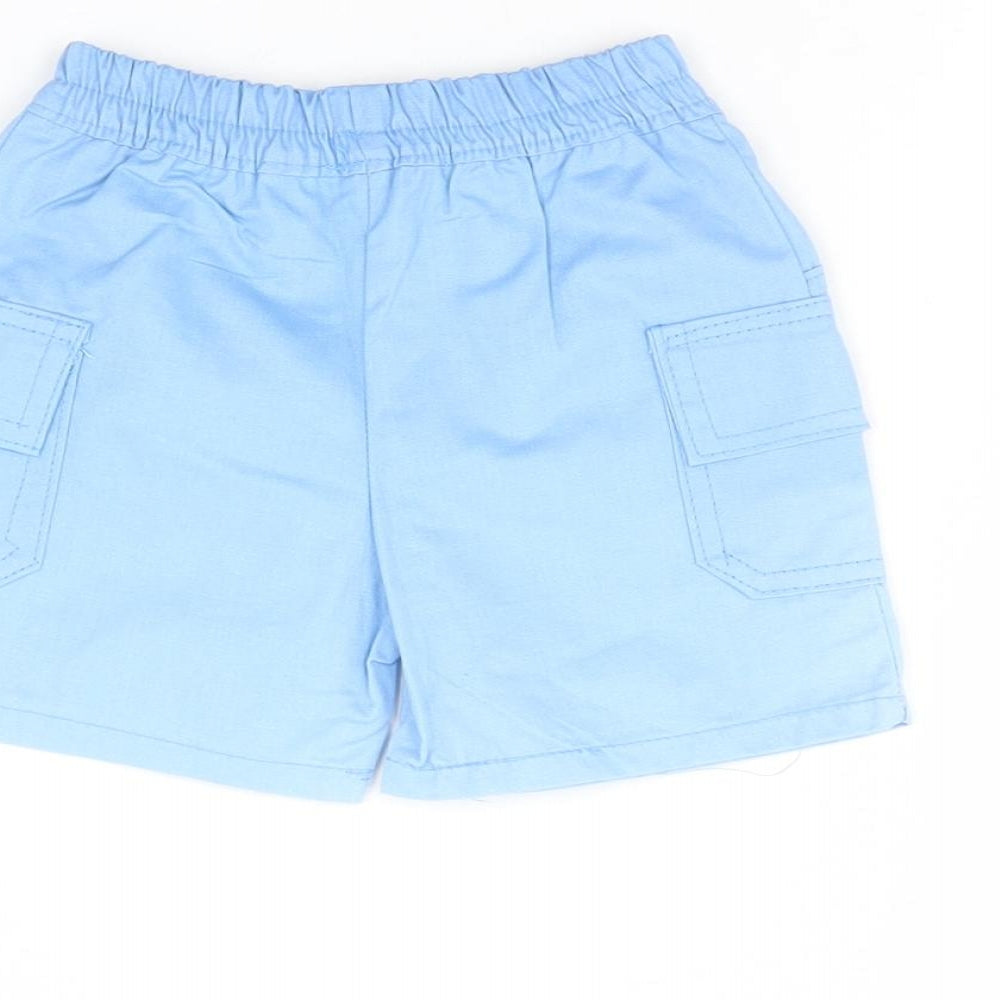 Brand and care label for Baby C Baby Blue Cropped Trousers, size 6-9, Months