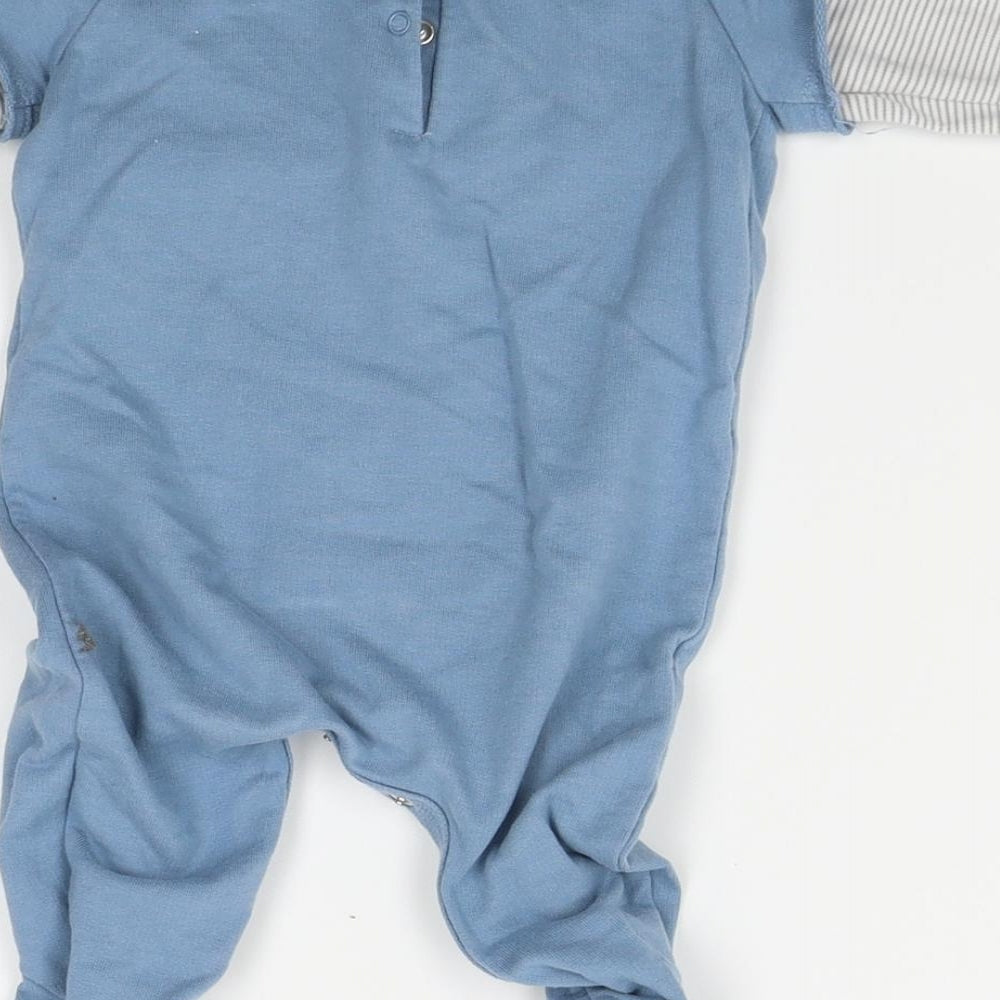 Brand and care label for Next boys’ blue babygrow one-piece, size 0-3, months
