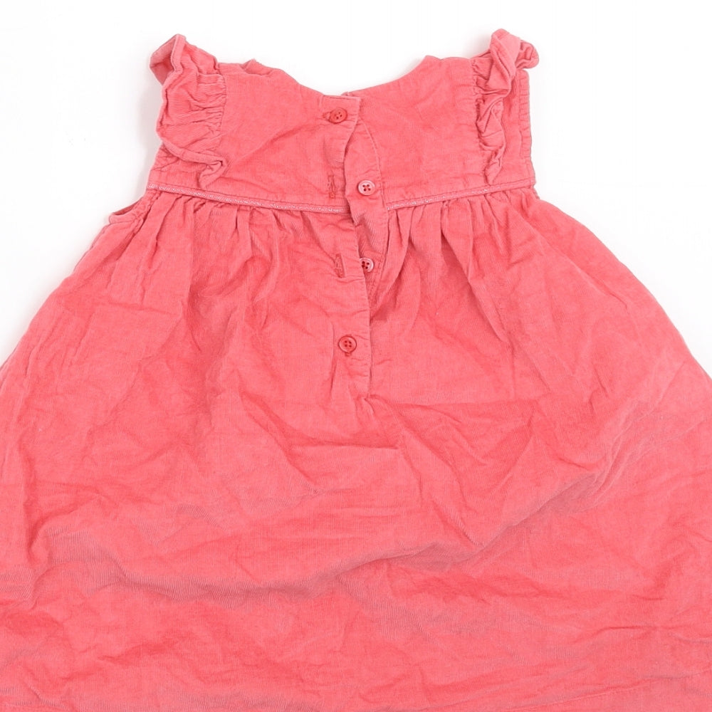 Brand and care label for Marks & Spencer girls’ orange corduroy a-line, size 9-12, months