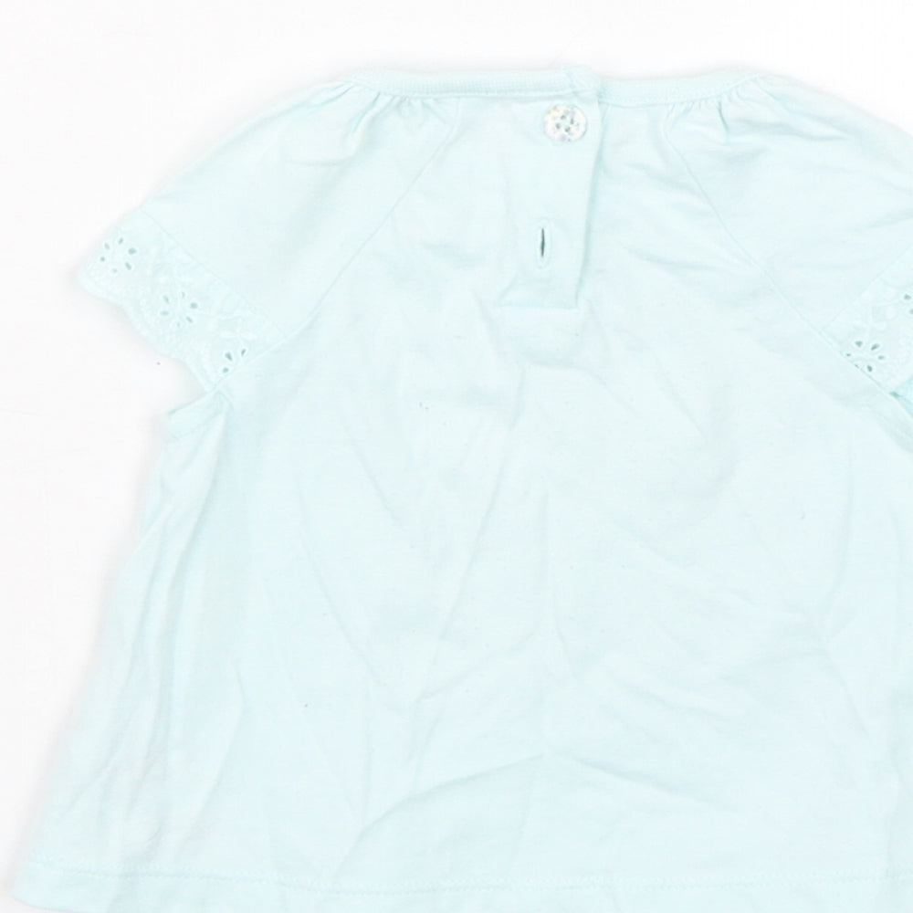 Brand and care label for F&F girls’ blue floral basic t-shirt, size 0-3, months