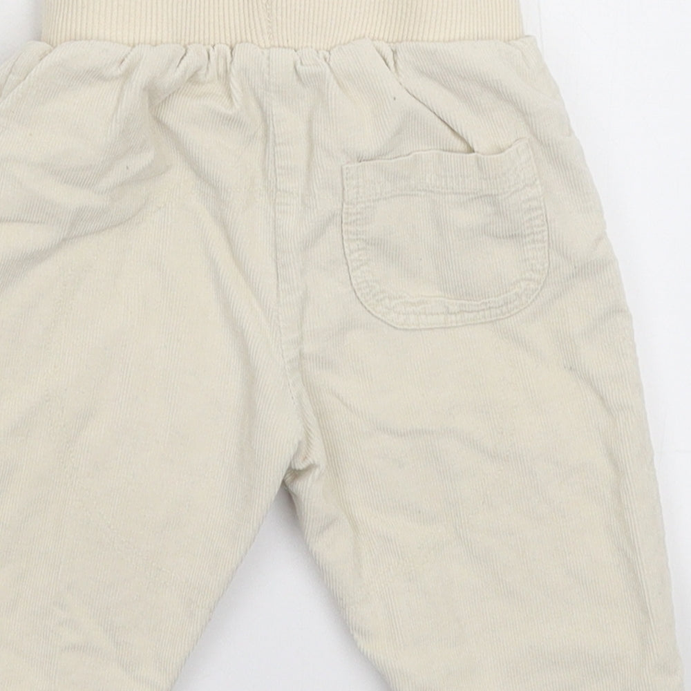 Brand and care label for Tu Baby Grey Corduroy Capri Trousers, size 6-9, Months