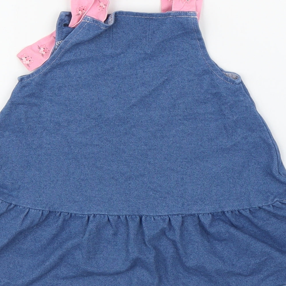Brand and care label for RESERVED girls’ blue denim a-line, size 9-12, months