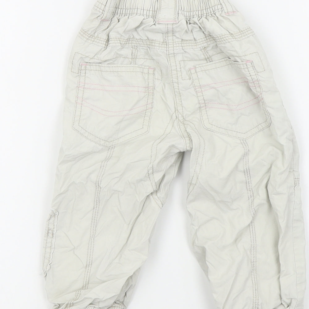 Brand and care label for Next girls’ beige colourblock cargo trousers, size 12-18, months