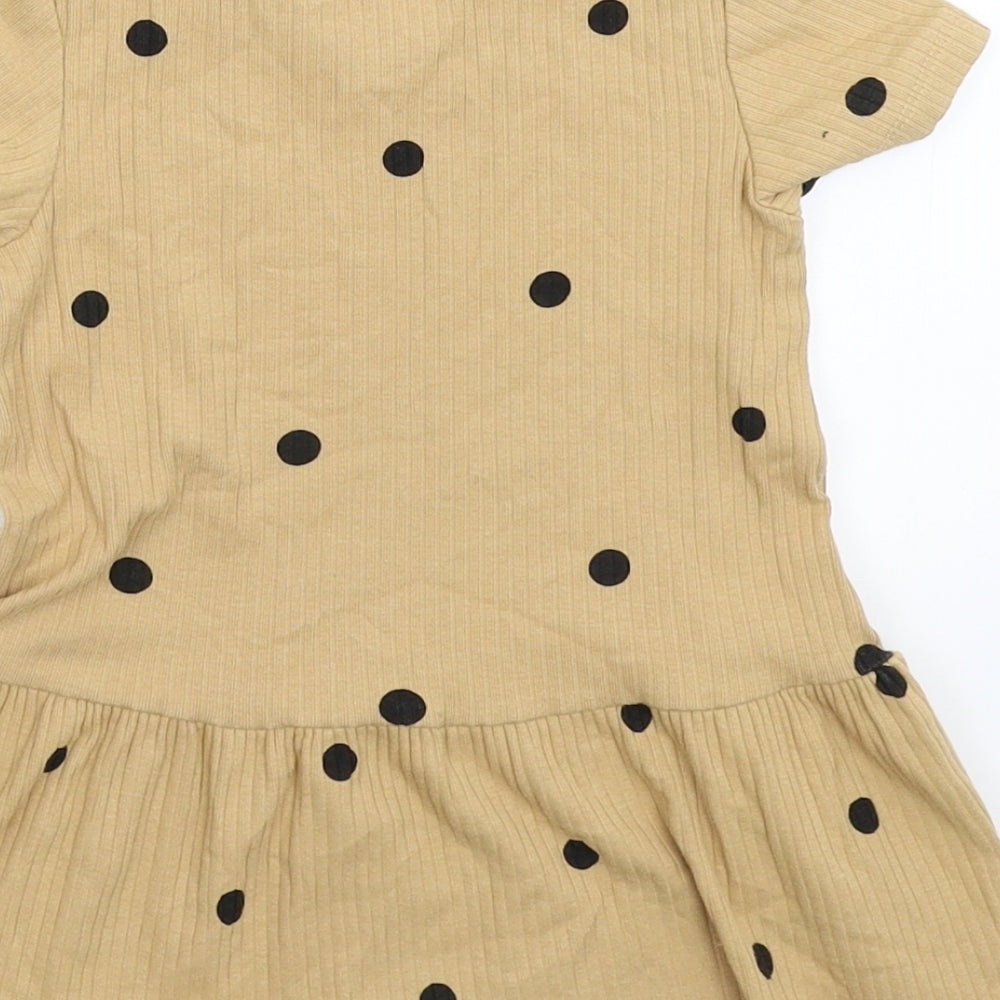 Brand and care label for H&M girls’ beige spotted fit & flare, size 9-12, months