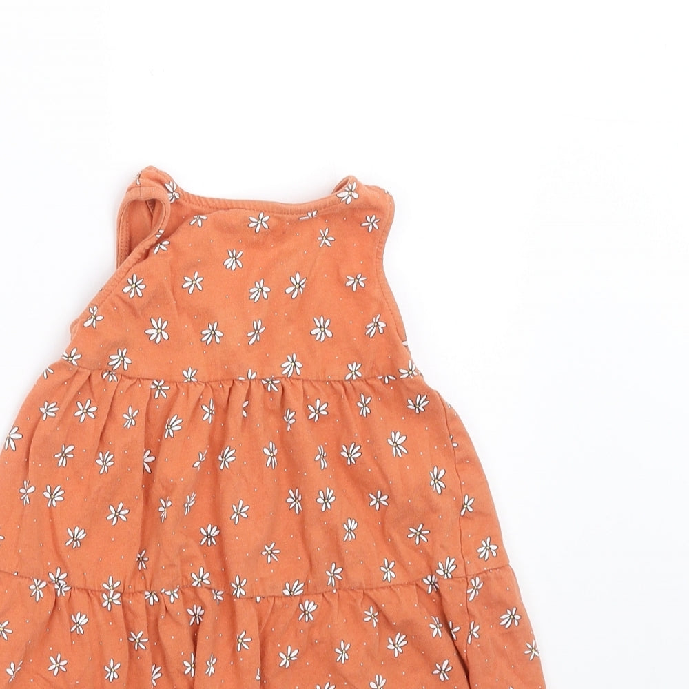Brand and care label for Primark girls’ beige floral trapeze & swing, size 12-18, months