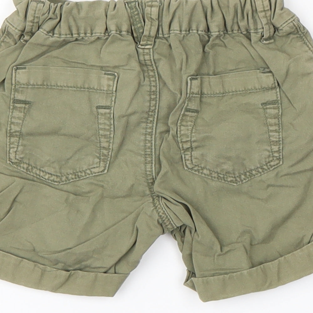Brand and care label for Nutmeg Baby Green Cropped Trousers, size 12-18, Months