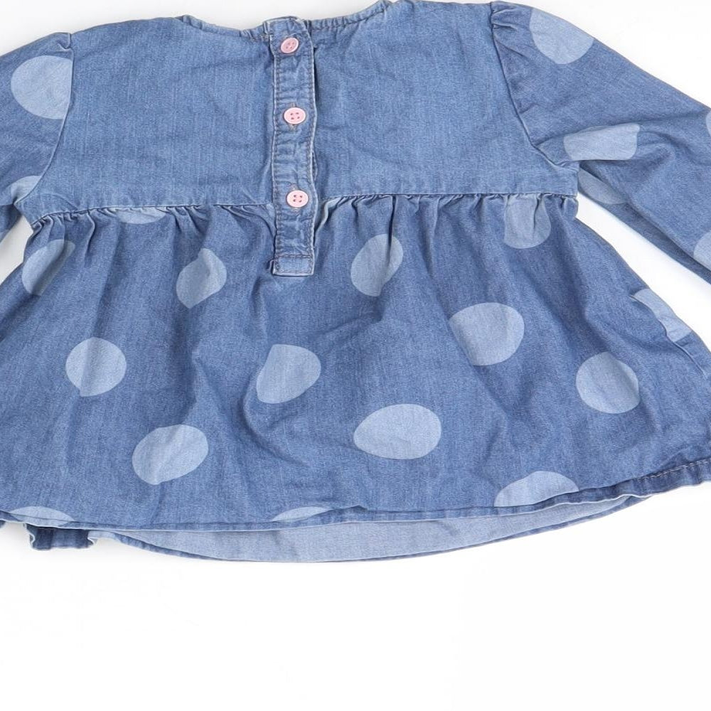 Brand and care label for Tu girls’ blue polka dot fit & flare, size 18, months