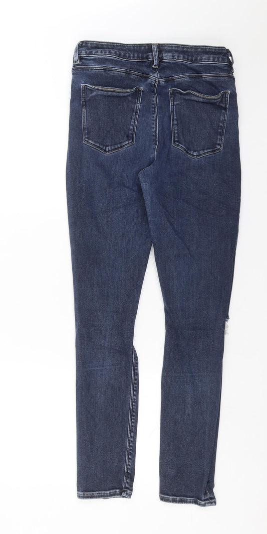 Back view of ASOS women’s blue denim skinny jeans, size UK 30, in, 28-inch leg