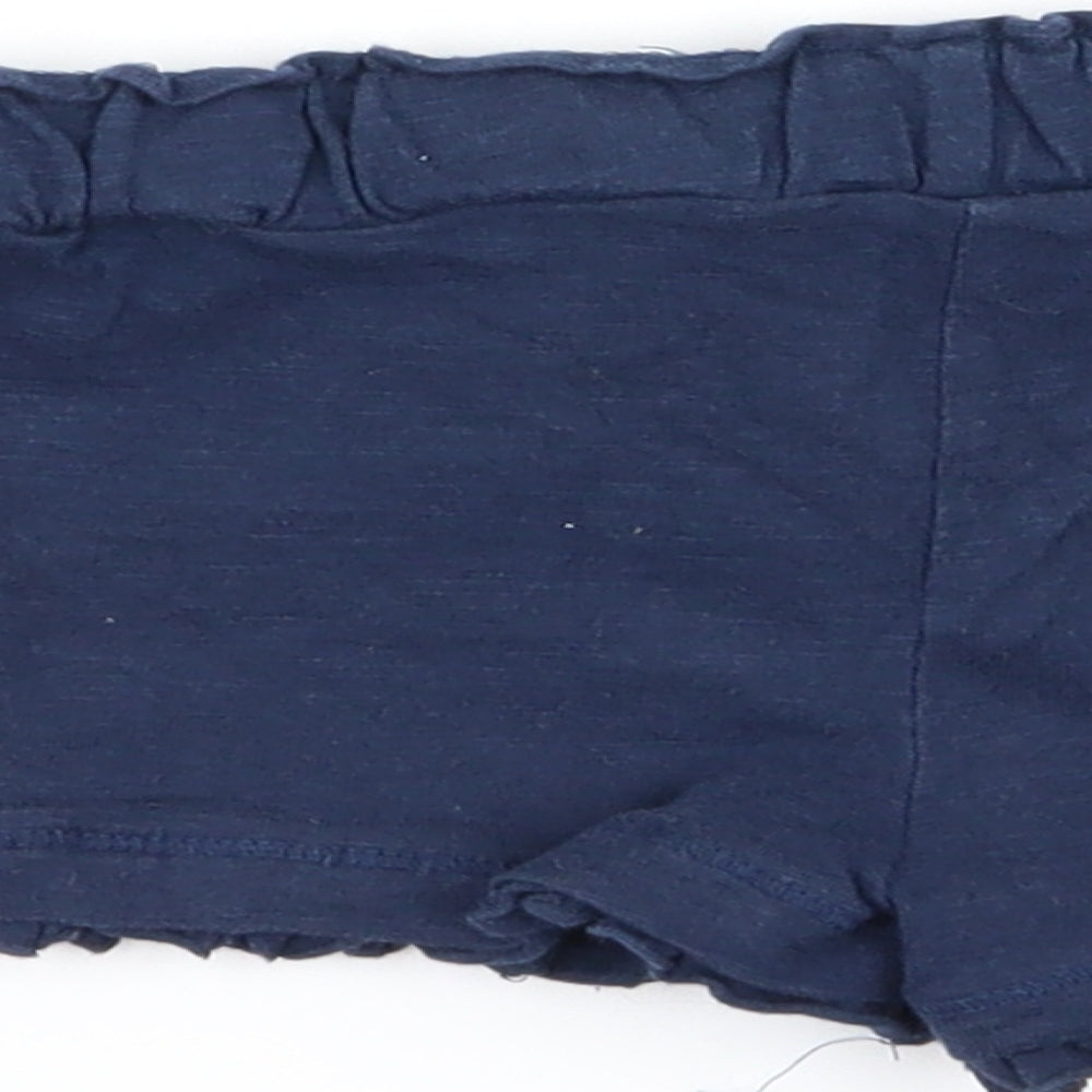 Brand and care label for F&F girls’ blue capri trousers, size 18-24, months - shorts