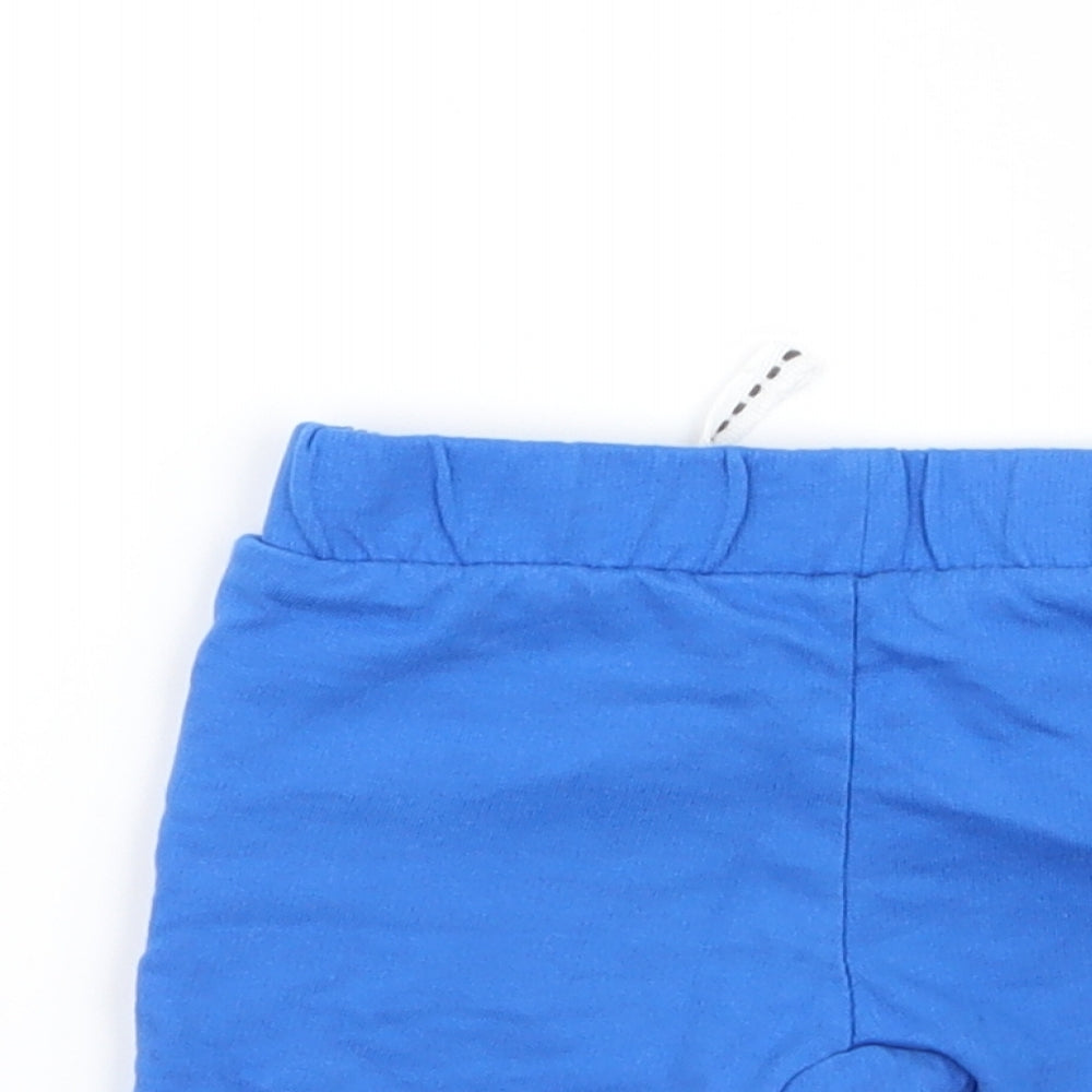 Brand and care label for miane boys’ blue capri trousers, size 0-3, months