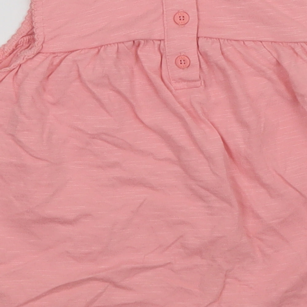 Brand and care label for F&F girls’ pink a-line, size 12-18, months