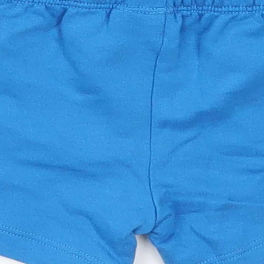 Brand and care label for F&F boys’ blue cropped trousers, size 3-6, months